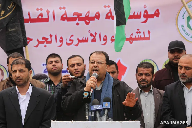 Palestinians hold placards during a protest to show solidarity with Palestinian prisoners held in Israeli Jails, in Gaza city, on April 12, 2017. Photo by Ashraf Amra