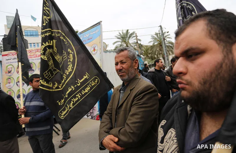 Palestinians hold placards during a protest to show solidarity with Palestinian prisoners held in Israeli Jails, in Gaza city, on April 12, 2017. Photo by Ashraf Amra