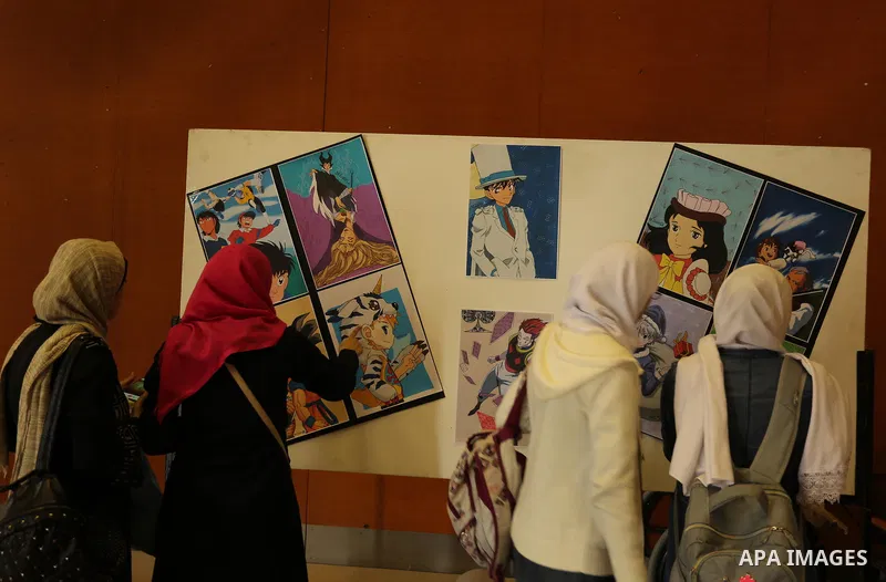 Palestinians attend the anime gallery for the disabled Mohammed Dalu, in Gaza city, on April 12, 2017. Photo by Ashraf Amra