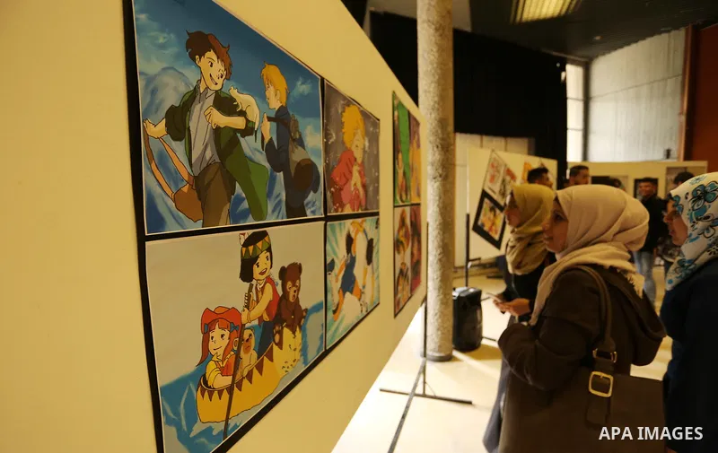 Palestinians attend the anime gallery for the disabled Mohammed Dalu, in Gaza city, on April 12, 2017. Photo by Ashraf Amra