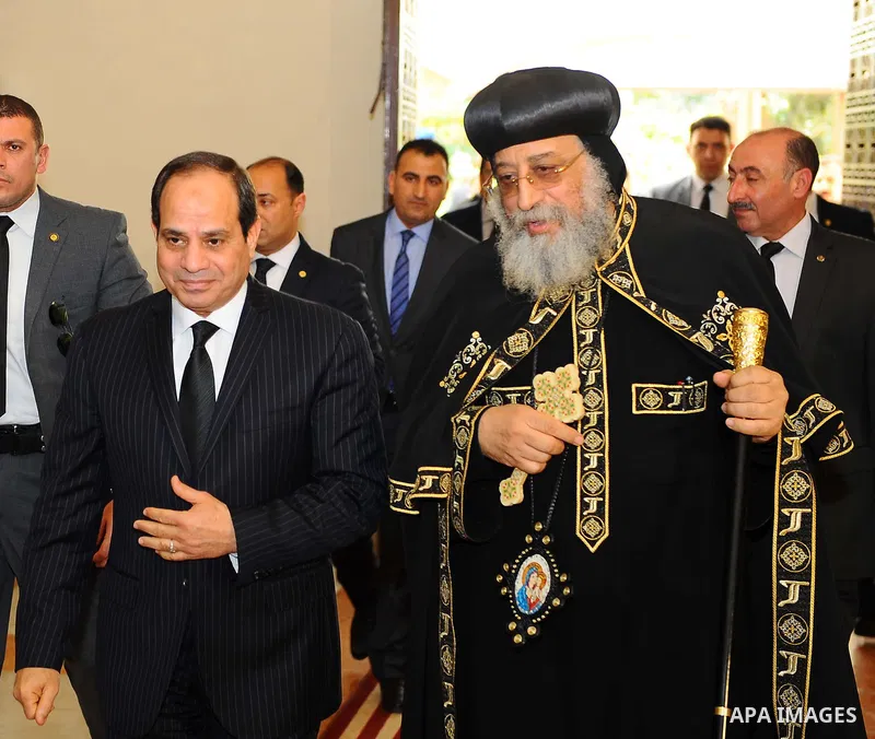 A handout picture released by the Egyptian Presidency April 13, 2017 shows Egyptian President Abdel Fattah al-Sisi offering his condolences to Coptic Pope Tawadros II at the headquarters of St. Mark's Coptic Orthodox Cat...