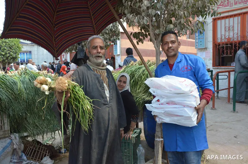 Egyptians buy Onions during preparation for the upcoming the Sham El Nessim, or the Festival of Spring Breeze, which marks the beginning of spring, in Cairo, on April 14, 2017. Photo by Amr Sayed