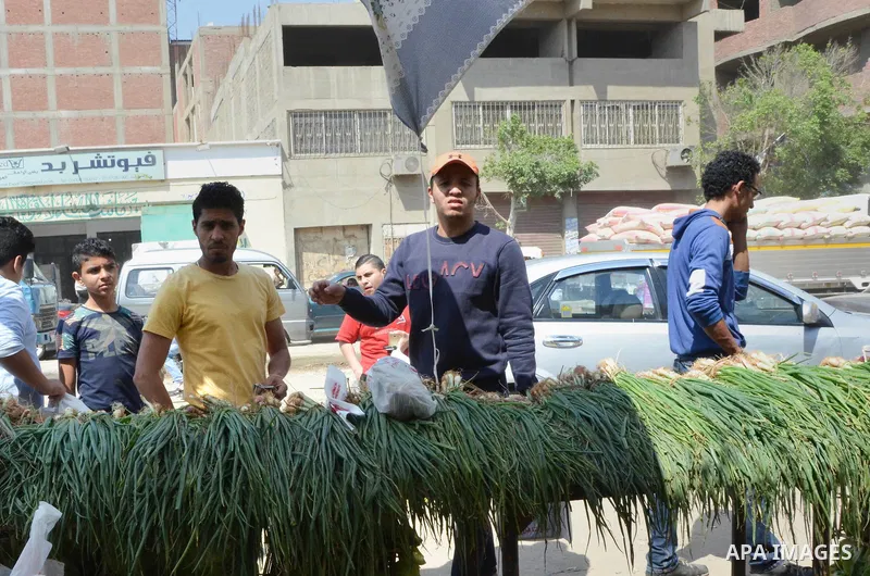 Egyptians buy Onions during preparation for the upcoming the Sham El Nessim, or the Festival of Spring Breeze, which marks the beginning of spring, in Cairo, on April 14, 2017. Photo by Amr Sayed