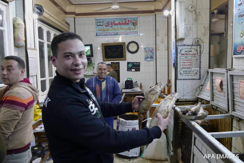 Egyptians buy the Herring or, salted fish during preparation for the upcoming the Sham El Nessim, or the Festival of Spring Breeze, which marks the beginning of spring, in Cairo, on April 14, 2017. Photo by Amr Sayed