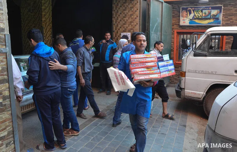 Egyptians buy the Herring or, salted fish during preparation for the upcoming the Sham El Nessim, or the Festival of Spring Breeze, which marks the beginning of spring, in Cairo, on April 14, 2017. Photo by Amr Sayed