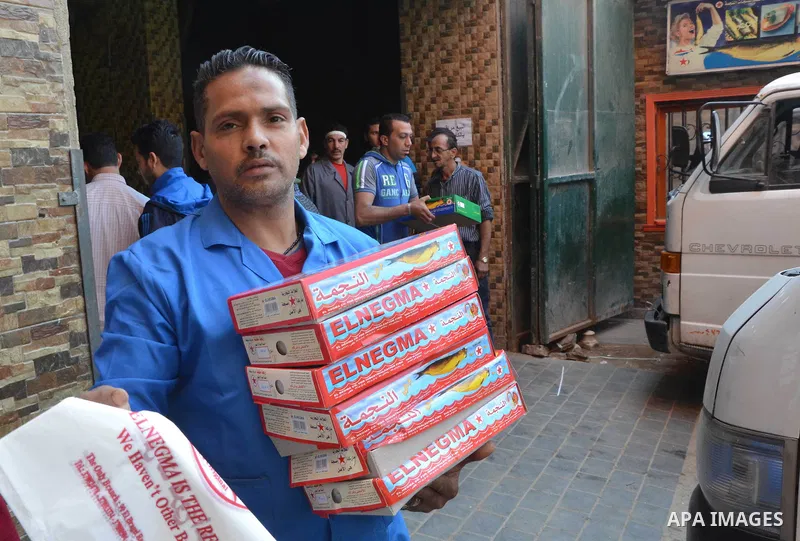 Egyptians buy the Herring or, salted fish during preparation for the upcoming the Sham El Nessim, or the Festival of Spring Breeze, which marks the beginning of spring, in Cairo, on April 14, 2017. Photo by Amr Sayed