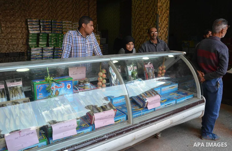 Egyptians buy the Herring or, salted fish during preparation for the upcoming the Sham El Nessim, or the Festival of Spring Breeze, which marks the beginning of spring, in Cairo, on April 14, 2017. Photo by Amr Sayed