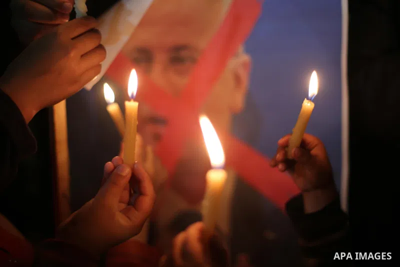 Supporters of the Palestinian Hamas movement hold placards and light candles during a protest against the Israeli blockade of the Gaza Strip, in Gaza city, on April 14, 2017. Photo by Mohammed Asad