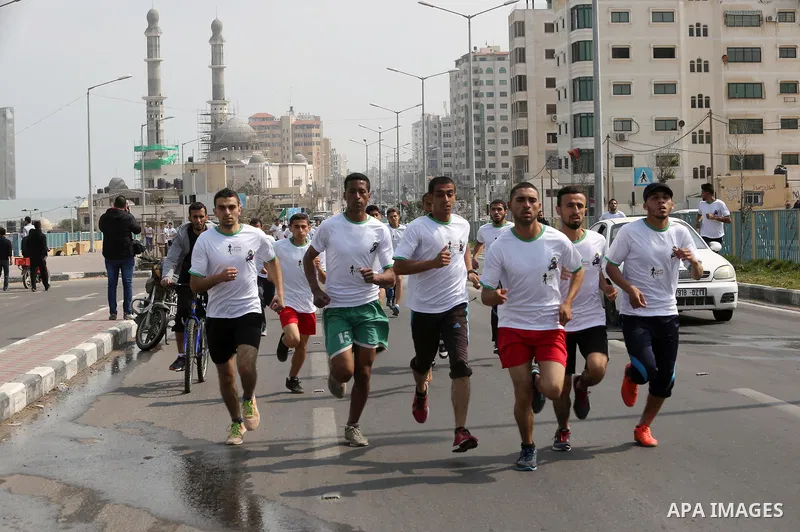 Palestinian youths take part in "Freedom Marathon" against the Israeli blockade of the Gaza Strip, in Gaza city on April 15, 2017. Photo by Ashraf Amra