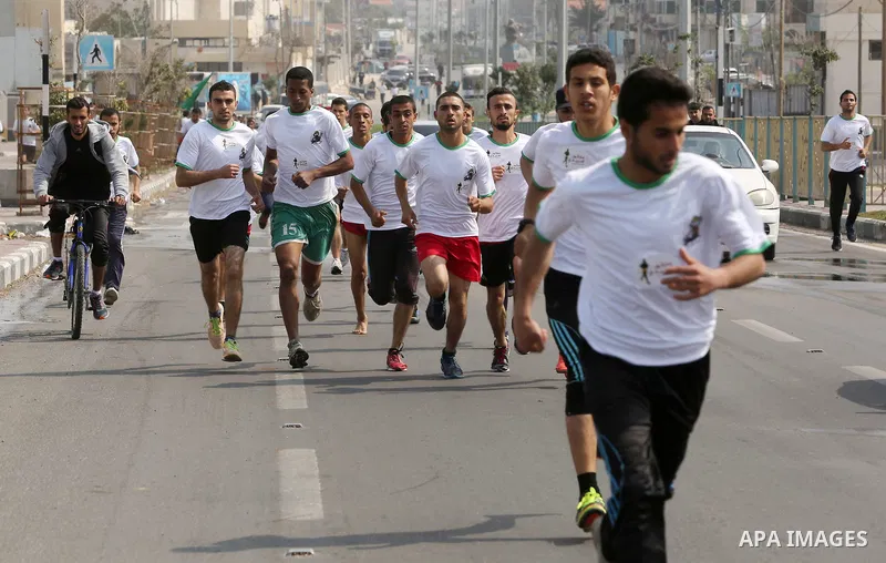 Palestinian youths take part in "Freedom Marathon" against the Israeli blockade of the Gaza Strip, in Gaza city on April 15, 2017. Photo by Ashraf Amra