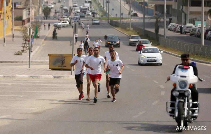 Palestinian youths take part in "Freedom Marathon" against the Israeli blockade of the Gaza Strip, in Gaza city on April 15, 2017. Photo by Ashraf Amra