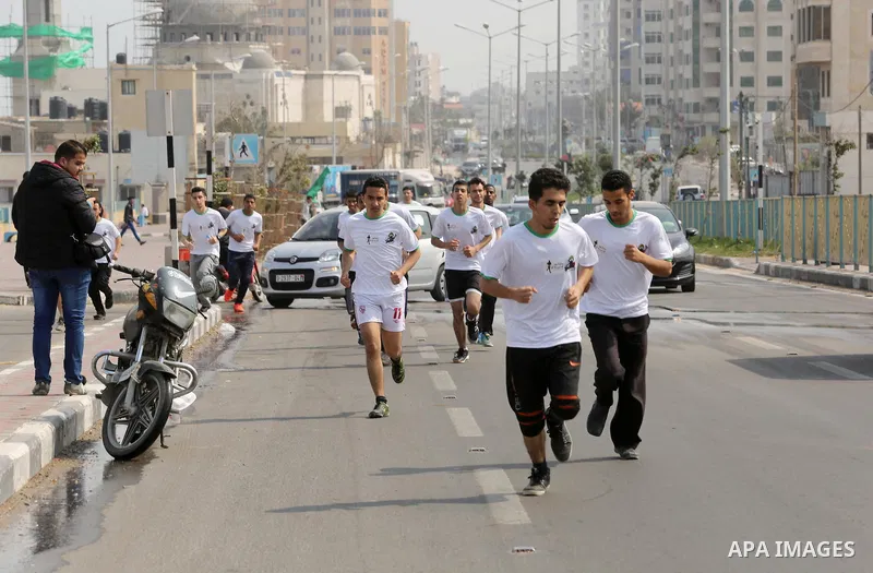 Palestinian youths take part in "Freedom Marathon" against the Israeli blockade of the Gaza Strip, in Gaza city on April 15, 2017. Photo by Ashraf Amra