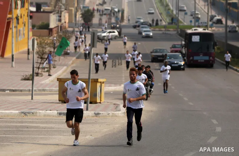 Palestinian youths take part in "Freedom Marathon" against the Israeli blockade of the Gaza Strip, in Gaza city on April 15, 2017. Photo by Ashraf Amra