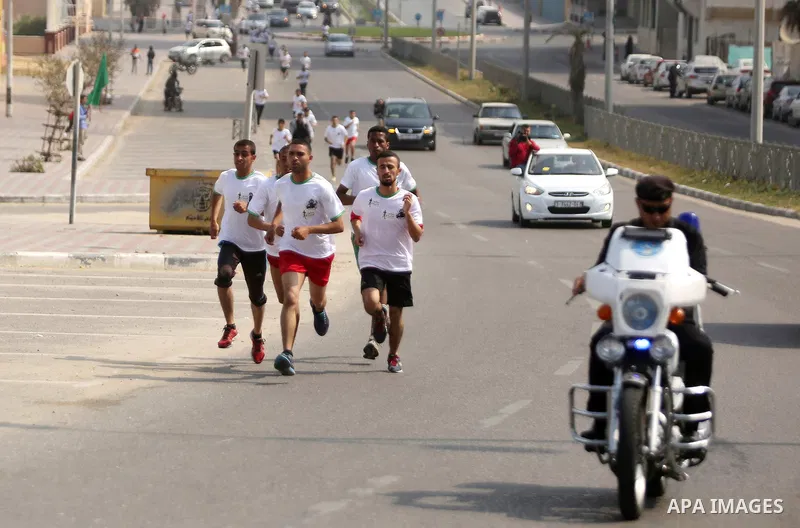 Palestinian youths take part in "Freedom Marathon" against the Israeli blockade of the Gaza Strip, in Gaza city on April 15, 2017. Photo by Ashraf Amra