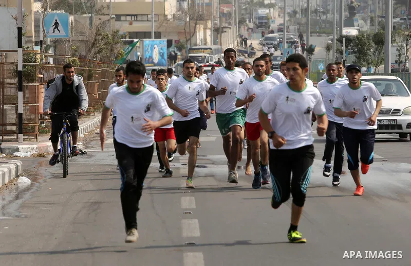 Palestinian youths take part in "Freedom Marathon" against the Israeli blockade of the Gaza Strip, in Gaza city on April 15, 2017. Photo by Ashraf Amra