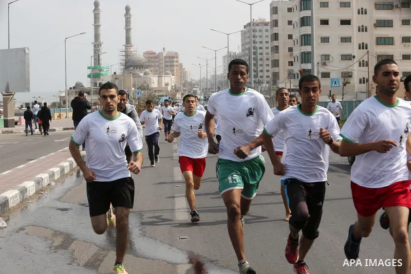 Palestinian youths take part in "Freedom Marathon" against the Israeli blockade of the Gaza Strip, in Gaza city on April 15, 2017. Photo by Ashraf Amra