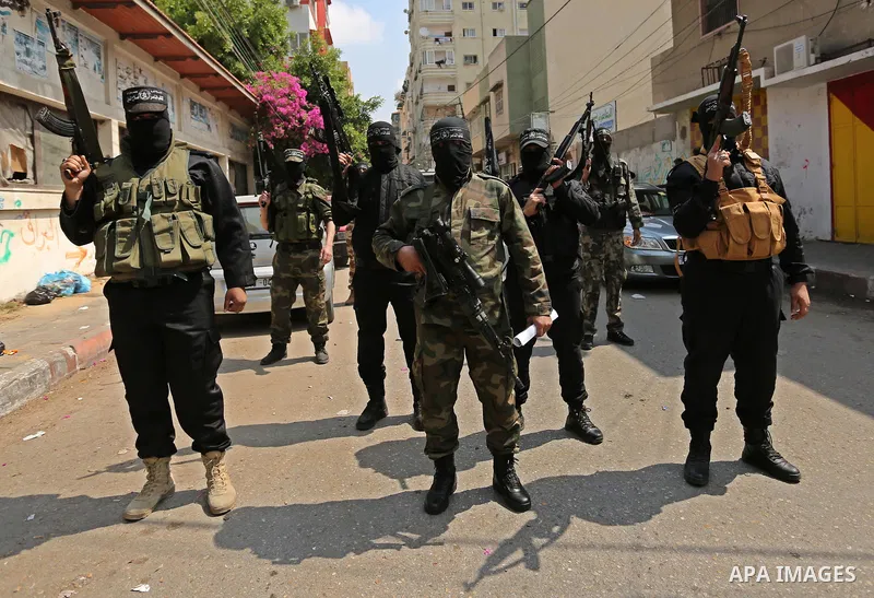 Palestinian militants of the Nasser Salah al-Din Brigades the military wing of the Popular Resistance movement arrive before a press conference, in Gaza City on April 15, 2017. Photo by Ashraf Amra