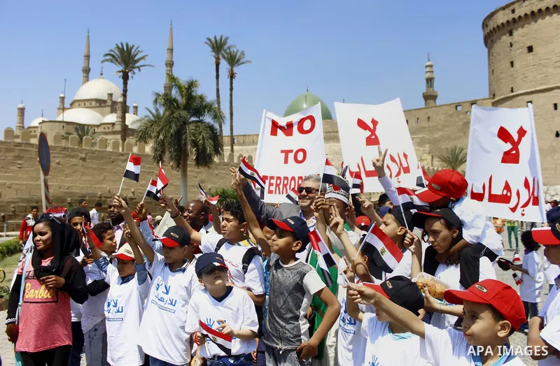 Egyptian students hold placards during a protest against terrorism in Cairo, Egypt, on April 15, 2017. Photo by Amr Sayed