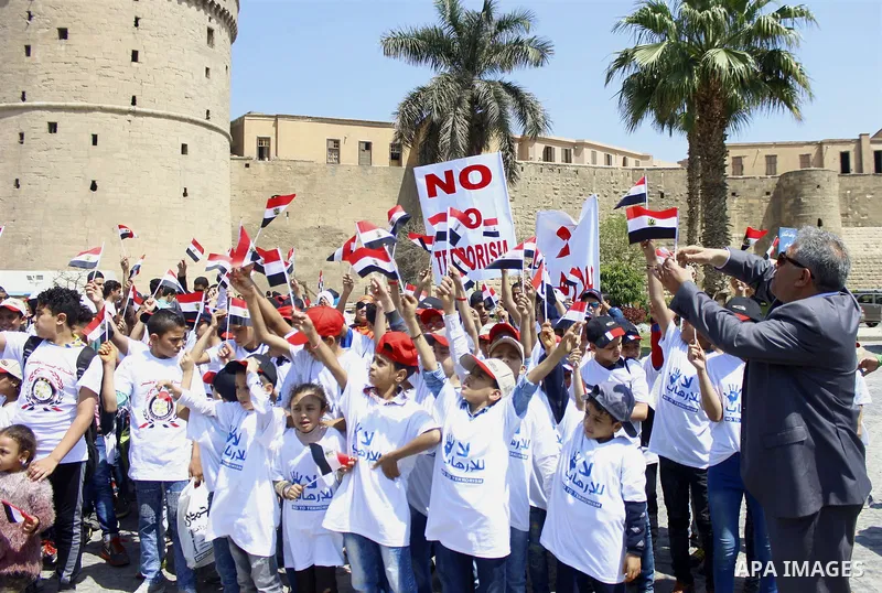 Egyptian students hold placards during a protest against terrorism in Cairo, Egypt, on April 15, 2017. Photo by Amr Sayed