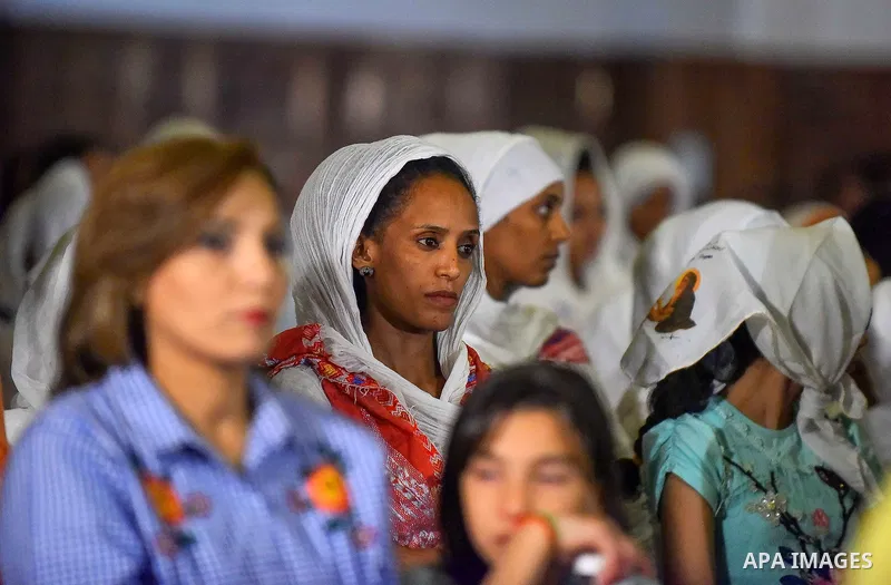 Egyptian Coptic Christians take part in an Easter Eve mass hosted by Pope Tawadros II at the St. Mark church in Cairo April 15, 2017. Photo by Amr Sayed