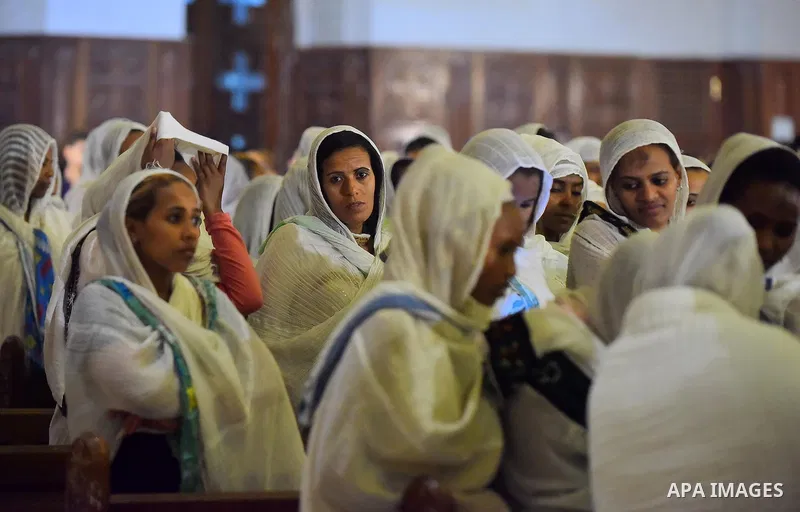 Egyptian Coptic Christians take part in an Easter Eve mass hosted by Pope Tawadros II at the St. Mark church in Cairo April 15, 2017. Photo by Amr Sayed