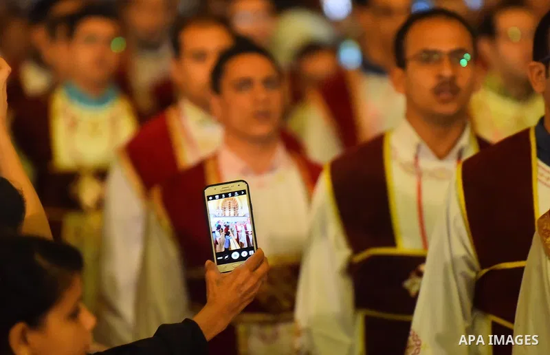 Egyptian Coptic Christians take part in an Easter Eve mass hosted by Pope Tawadros II at the St. Mark church in Cairo April 15, 2017. Photo by Amr Sayed