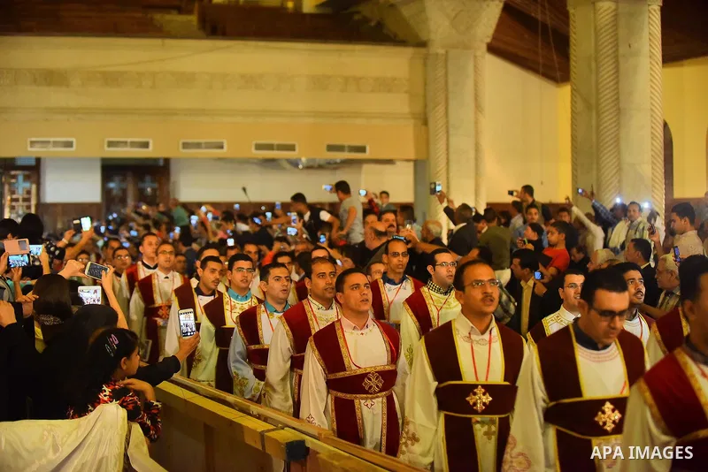 Egyptian Coptic Christians take part in an Easter Eve mass hosted by Pope Tawadros II at the St. Mark church in Cairo April 15, 2017. Photo by Amr Sayed