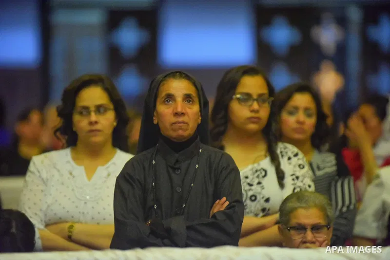 Egyptian Coptic Christians take part in an Easter Eve mass hosted by Pope Tawadros II at the St. Mark church in Cairo April 15, 2017. Photo by Amr Sayed