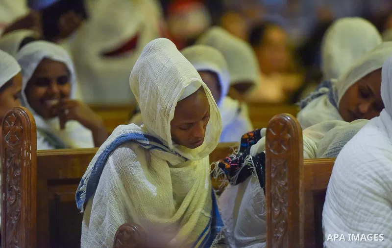 Egyptian Coptic Christians take part in an Easter Eve mass hosted by Pope Tawadros II at the St. Mark church in Cairo April 15, 2017. Photo by Amr Sayed