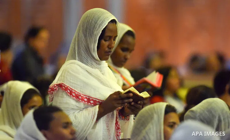 Egyptian Coptic Christians take part in an Easter Eve mass hosted by Pope Tawadros II at the St. Mark church in Cairo April 15, 2017. Photo by Amr Sayed