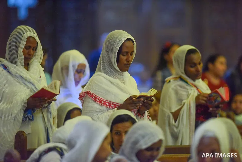 Egyptian Coptic Christians take part in an Easter Eve mass hosted by Pope Tawadros II at the St. Mark church in Cairo April 15, 2017. Photo by Amr Sayed
