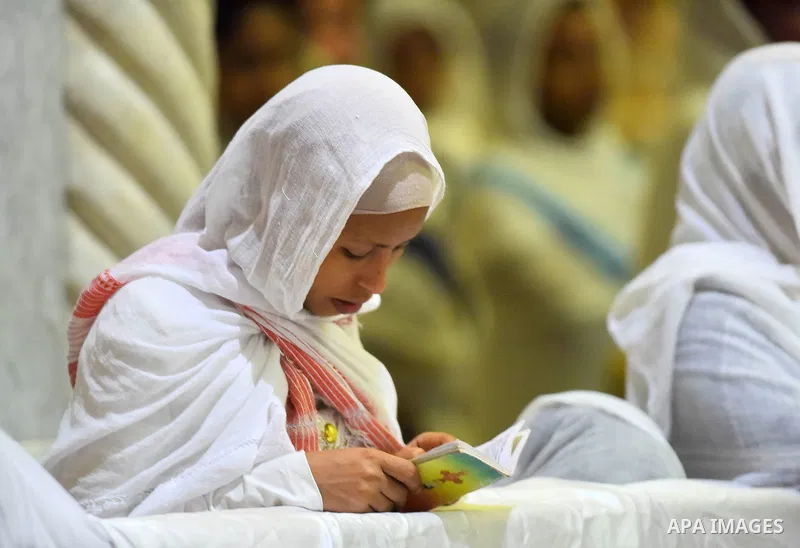 Egyptian Coptic Christians take part in an Easter Eve mass hosted by Pope Tawadros II at the St. Mark church in Cairo April 15, 2017. Photo by Amr Sayed
