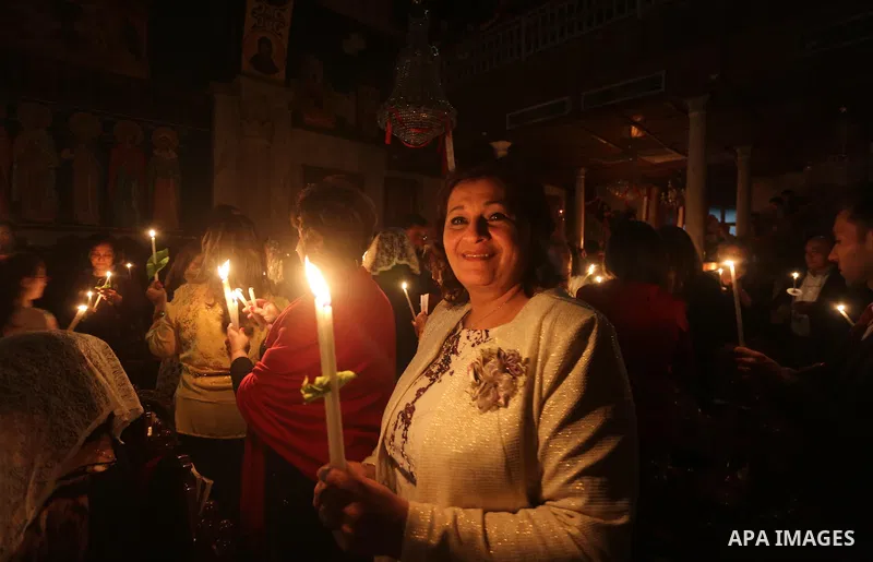 Orthodox Christian worshippers attend a prayer during the Easter Eve mass at the St. Porphyrios church in Gaza City, Saturday, April 15, 2017. Christians have gathered at the church for the fire ceremony that celebrates...