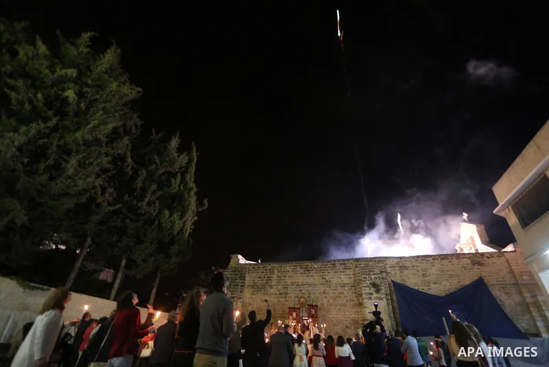 Orthodox Christian worshippers attend a prayer during the Easter Eve mass at the St. Porphyrios church in Gaza City, Saturday, April 15, 2017. Christians have gathered at the church for the fire ceremony that celebrates...