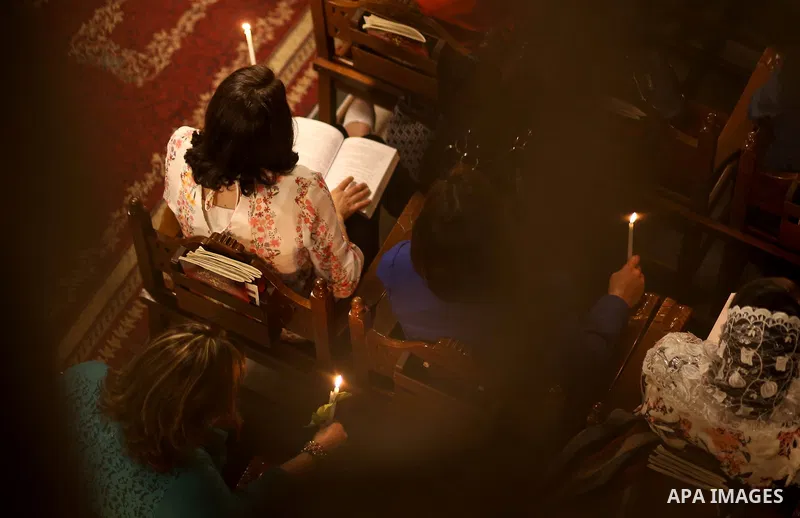 Orthodox Christian worshippers attend a prayer during the Easter Eve mass at the St. Porphyrios church in Gaza City, Saturday, April 15, 2017. Christians have gathered at the church for the fire ceremony that celebrates...