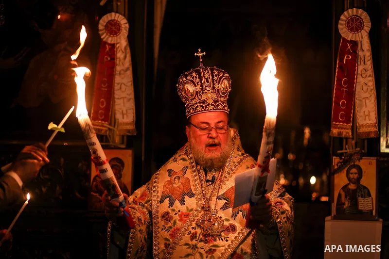 Archbishop Alexios leads the Easter Eve mass prayer at the St. Porphyrios church in Gaza City, Saturday, April 15, 2017. Christians have gathered at the church for the fire ceremony that celebrates Jesus' resurrection. P...