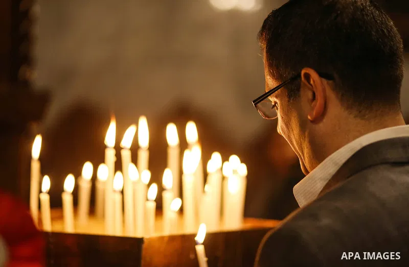 Orthodox Christian worshippers attend a prayer during the Easter Eve mass at the St. Porphyrios church in Gaza City, Saturday, April 15, 2017. Christians have gathered at the church for the fire ceremony that celebrates...