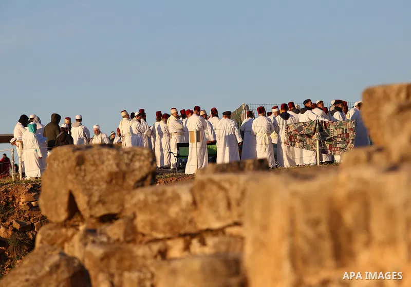 Members of the Samaritan sect take part in a traditional pilgrimage marking the holiday of Passover atop Mount Gerizim near the West Bank city of Nablus, on April 17, 2017. The Samaritans practice a religion that is base...