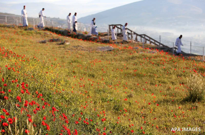 Members of the Samaritan sect take part in a traditional pilgrimage marking the holiday of Passover atop Mount Gerizim near the West Bank city of Nablus, on April 17, 2017. The Samaritans practice a religion that is base...