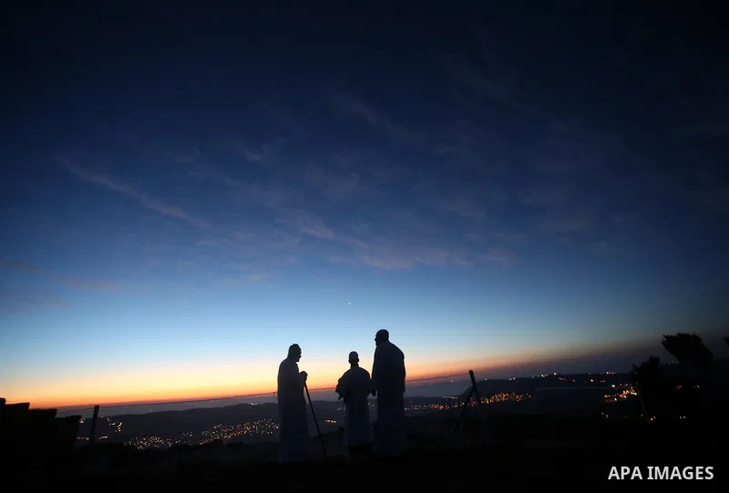 Members of the Samaritan sect take part in a traditional pilgrimage marking the holiday of Passover atop Mount Gerizim near the West Bank city of Nablus, on April 17, 2017. The Samaritans practice a religion that is base...