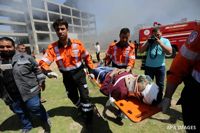Palestinian Civil Defense members take part in a drill, in Gaza city, on April 18, 2017. Photo by Ashraf Amra