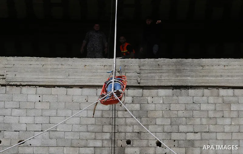 Palestinian Civil Defense members take part in a drill, in Gaza city, on April 18, 2017. Photo by Ashraf Amra