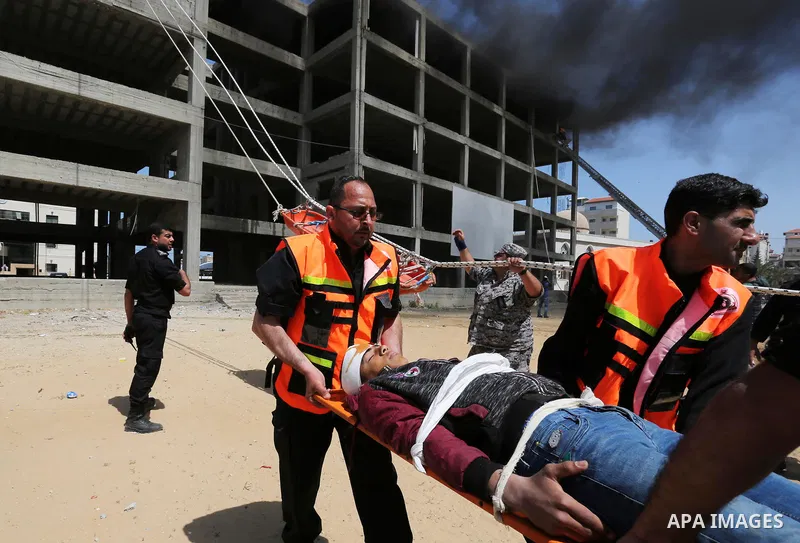 Palestinian Civil Defense members take part in a drill, in Gaza city, on April 18, 2017. Photo by Ashraf Amra