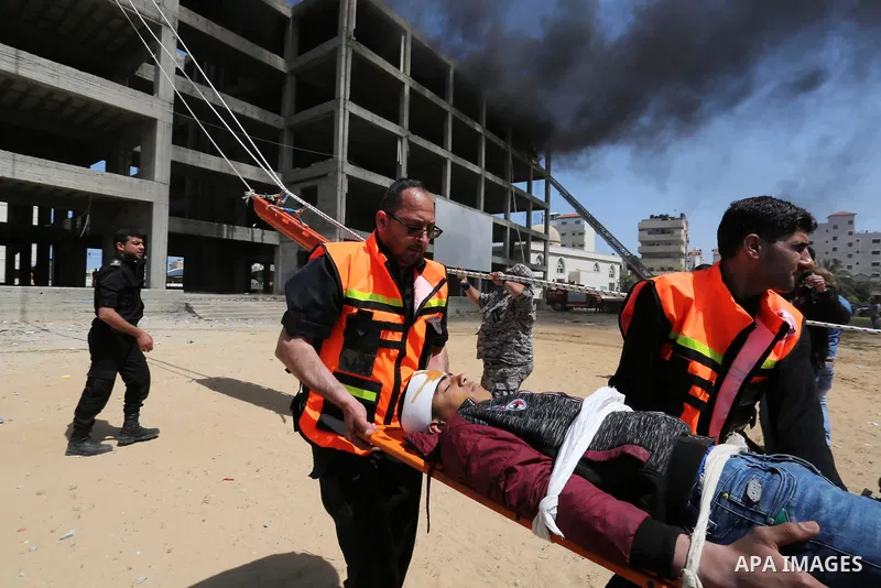 Palestinian Civil Defense members take part in a drill, in Gaza city, on April 18, 2017. Photo by Ashraf Amra