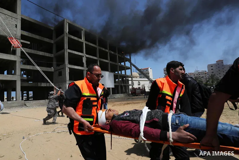 Palestinian Civil Defense members take part in a drill, in Gaza city, on April 18, 2017. Photo by Ashraf Amra