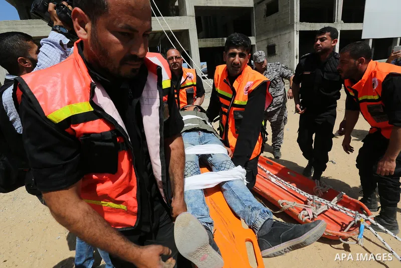 Palestinian Civil Defense members take part in a drill, in Gaza city, on April 18, 2017. Photo by Ashraf Amra