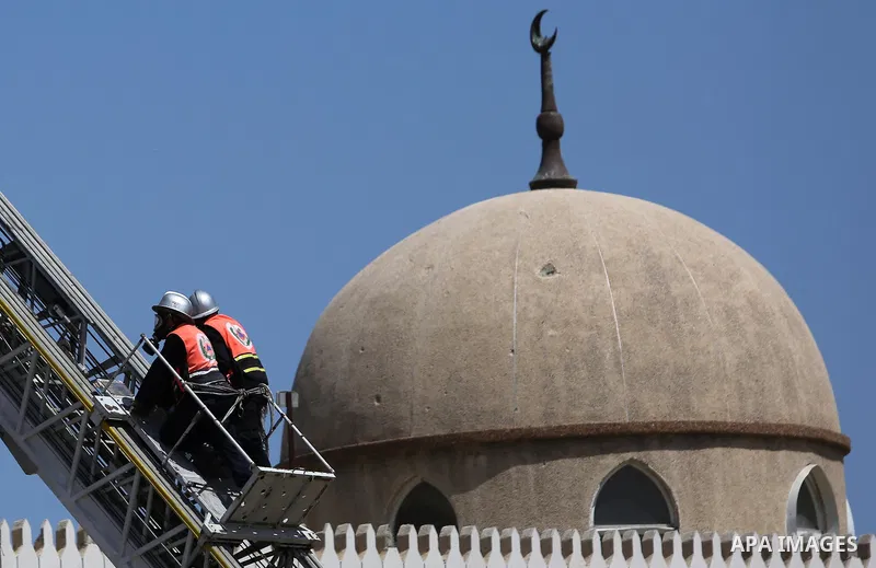 Palestinian Civil Defense members take part in a drill, in Gaza city, on April 18, 2017. Photo by Ashraf Amra