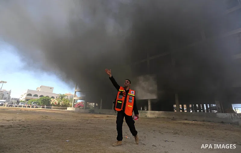 Palestinian Civil Defense members take part in a drill, in Gaza city, on April 18, 2017. Photo by Ashraf Amra