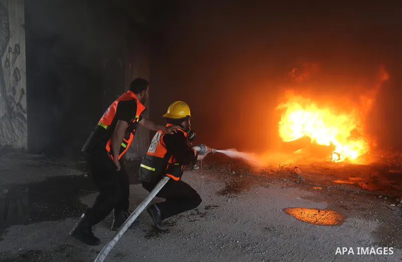 Palestinian Civil Defense members take part in a drill, in Gaza city, on April 18, 2017. Photo by Ashraf Amra