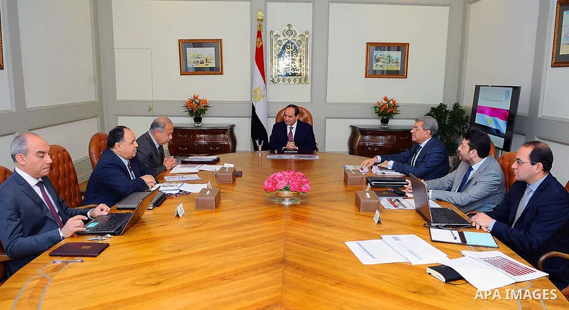 Egyptian President Abdel Fattah al-Sisi meets with Sherif Ismail Prime Minister, and Minister of Finance Amr El Garhy in Cairo, Egypt, on April 18, 2017. Photo by Egyptian President Office